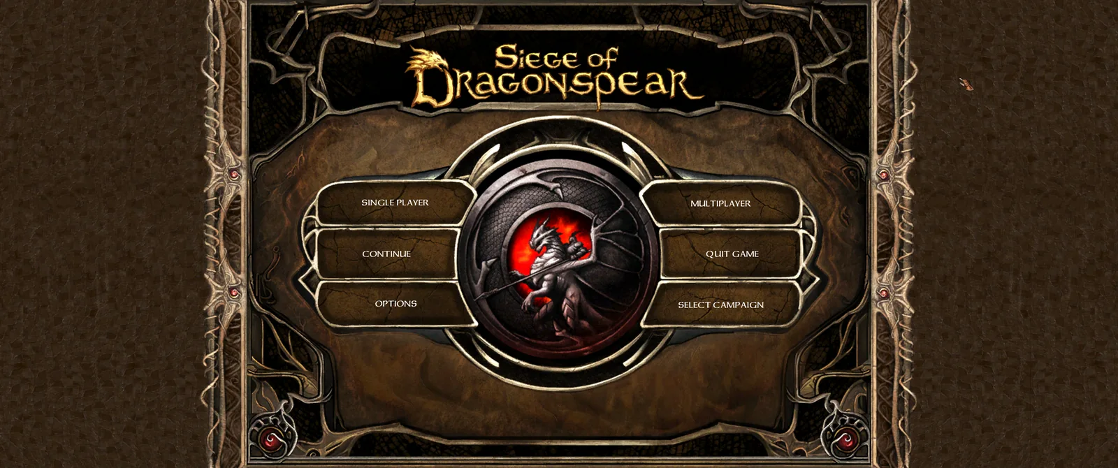 The Siege of Dragonspear main menu on the 2.5 install: a centred stone frame with Single Player, Continue, Options, Multiplayer, Quit Game and Select Campaign buttons around a dragon medallion.